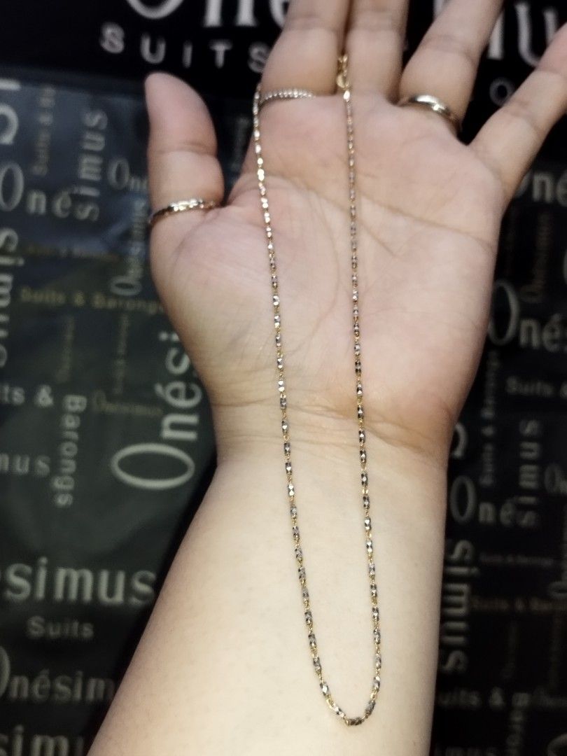 14k Two-Tone Gold Beaded Chain Necklace (Category: Necklaces) located in Manila. Submitted by Cie28 (Listing ID 1468170083, Image 2). Description: - 14k Two-tone gold necklace with alternating yellow and white gold textured bead links. - Weighs 3.7 grams on the digital scale. - See photos with dent/flaw (hindi naman halata pag sinuot kasi nsa likod naman sya) - Delicate link design catches the light nicely. - Standard clasp closure at the back. C