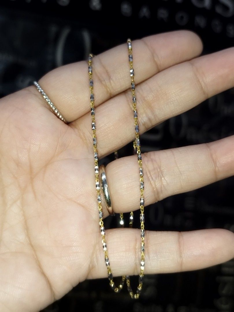 14k Two-Tone Gold Beaded Chain Necklace (Category: Necklaces) located in Manila. Submitted by Cie28 (Listing ID 1468170083, Image 3). Description: - 14k Two-tone gold necklace with alternating yellow and white gold textured bead links. - Weighs 3.7 grams on the digital scale. - See photos with dent/flaw (hindi naman halata pag sinuot kasi nsa likod naman sya) - Delicate link design catches the light nicely. - Standard clasp closure at the back. C
