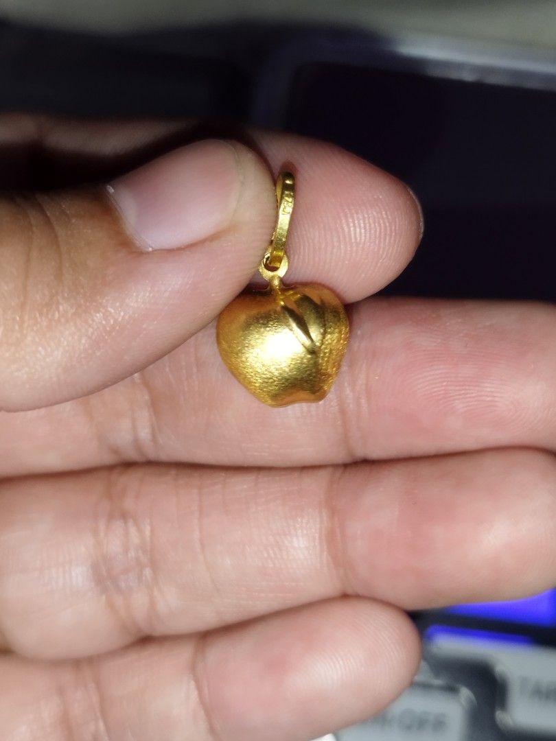 18k Gold Apple Pendant Charm / Pendant (Category: Charms) located in Manila. Submitted by Cie28 (Listing ID 1468172084, Image 1). Description: - 18k Gold apple pendant / charm - Weight: 1.4 grams (verified on digital scale) - Size: Approximately the size of a one-peso coin - Bail: Ready to fit any chain - Style: Versatile piece, great for daily wear or layering - Pawnable .