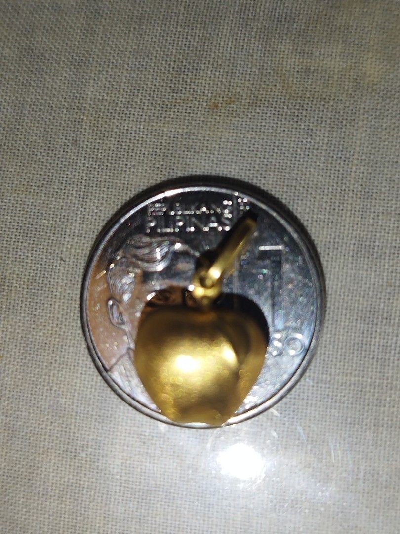 18k Gold Apple Pendant Charm / Pendant (Category: Charms) located in Manila. Submitted by Cie28 (Listing ID 1468172084, Image 3). Description: - 18k Gold apple pendant / charm - Weight: 1.4 grams (verified on digital scale) - Size: Approximately the size of a one-peso coin - Bail: Ready to fit any chain - Style: Versatile piece, great for daily wear or layering - Pawnable .