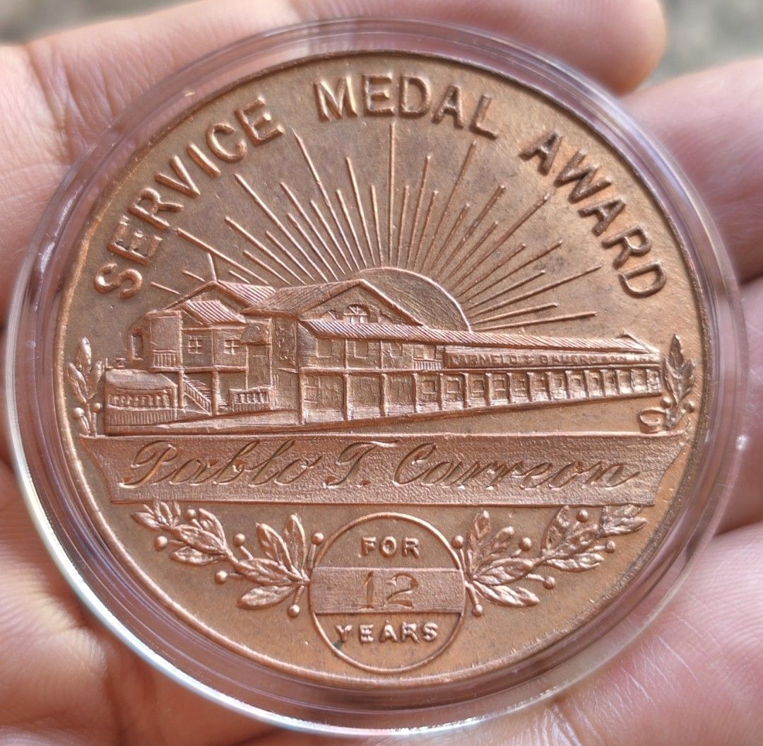 1937 Carmelo & buermann philippine medal (Category: Currency) located in Taguig. Submitted by ezekiel103 (Listing ID 1468098412, Image 2). Description: 1 medal only - Rare 1887-1937 Carmelo & Bauermann golden anniversary souvenir medal - Engraved with "Pablo T. Carreon" for 12 years of service - Excellent piece of Philippine printing history and vintage memorabilia 8,500 nalang.