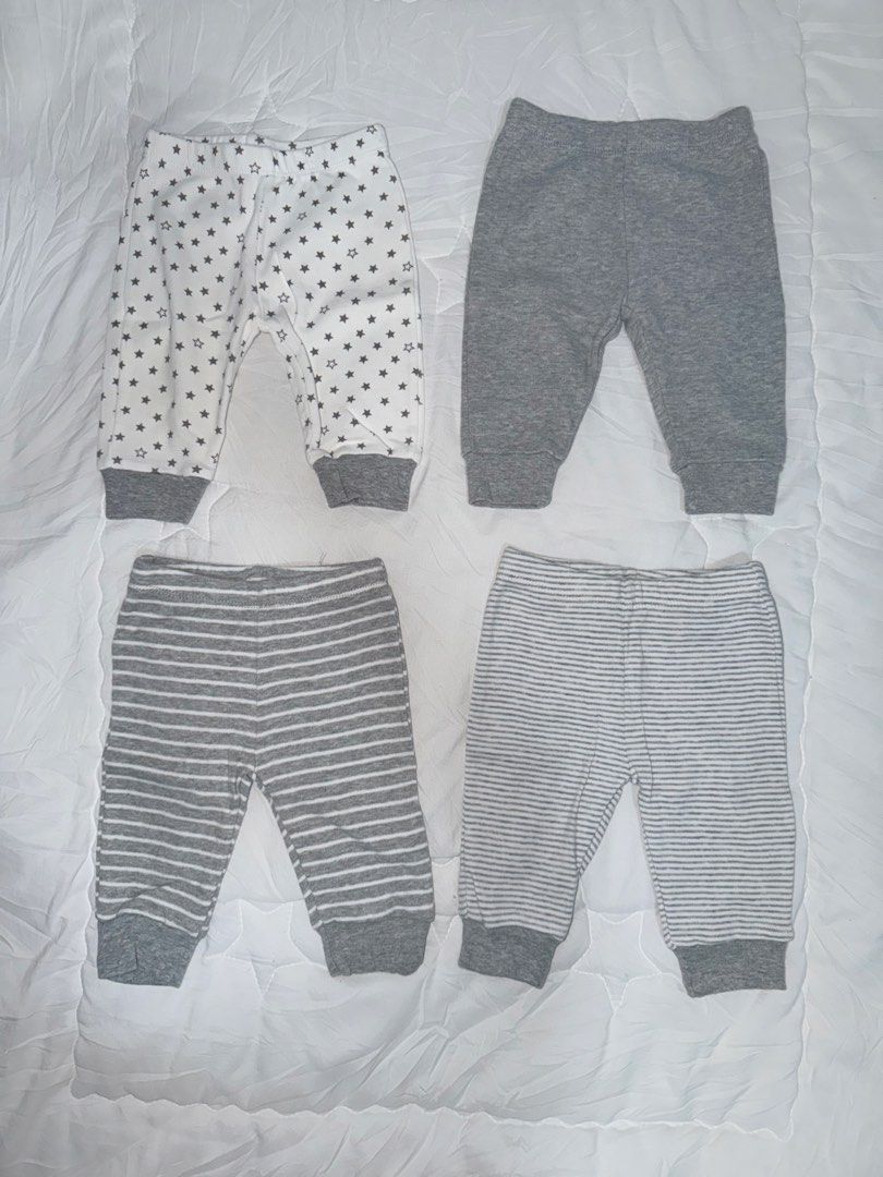 4 pcs Gray Pajama Pants for Baby (Category: Babies & Kids Fashion) located in Caloocan City. Submitted by labellecollection (Listing ID 1468217997, Image 1). Description: - Includes 4 pairs of baby pants in neutral gray and white designs: star print, solid heather gray, thick stripes, and fine stripes - Sized for newborns and 3 months (SIZE_NEWBORN, SIZE_3_MONTHS) - Made from soft, breathable cotton material for all-day comfort - Designed with co