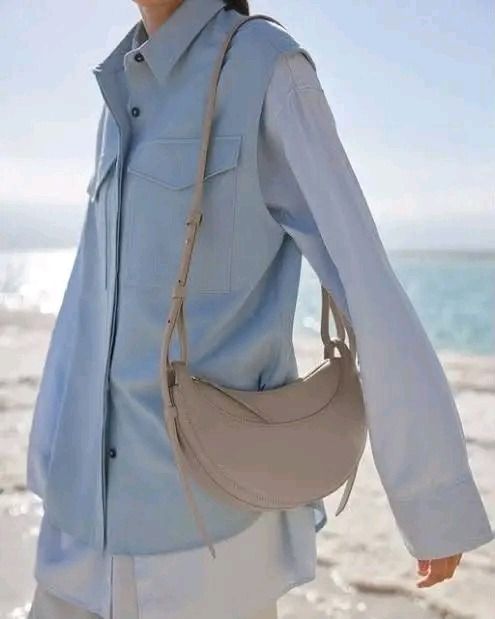 💜 Polene Numéro DixEdition Textured Taupe Bsg (Category: Luxury Bags & Wallets) located in Lala. Submitted by mohsin0825 (Listing ID 1468282455, Image 2). Description: Polene Numéro DixEdition Textured Taupe Bag 13,990p plus sf - Color: Textured Taupe - Design: Trendy crescent / half-moon shape with structured paneling - Versatility: Adjustable strap for comfortable shoulder or crossbody styling - Material: Premium textured finish with clean sti