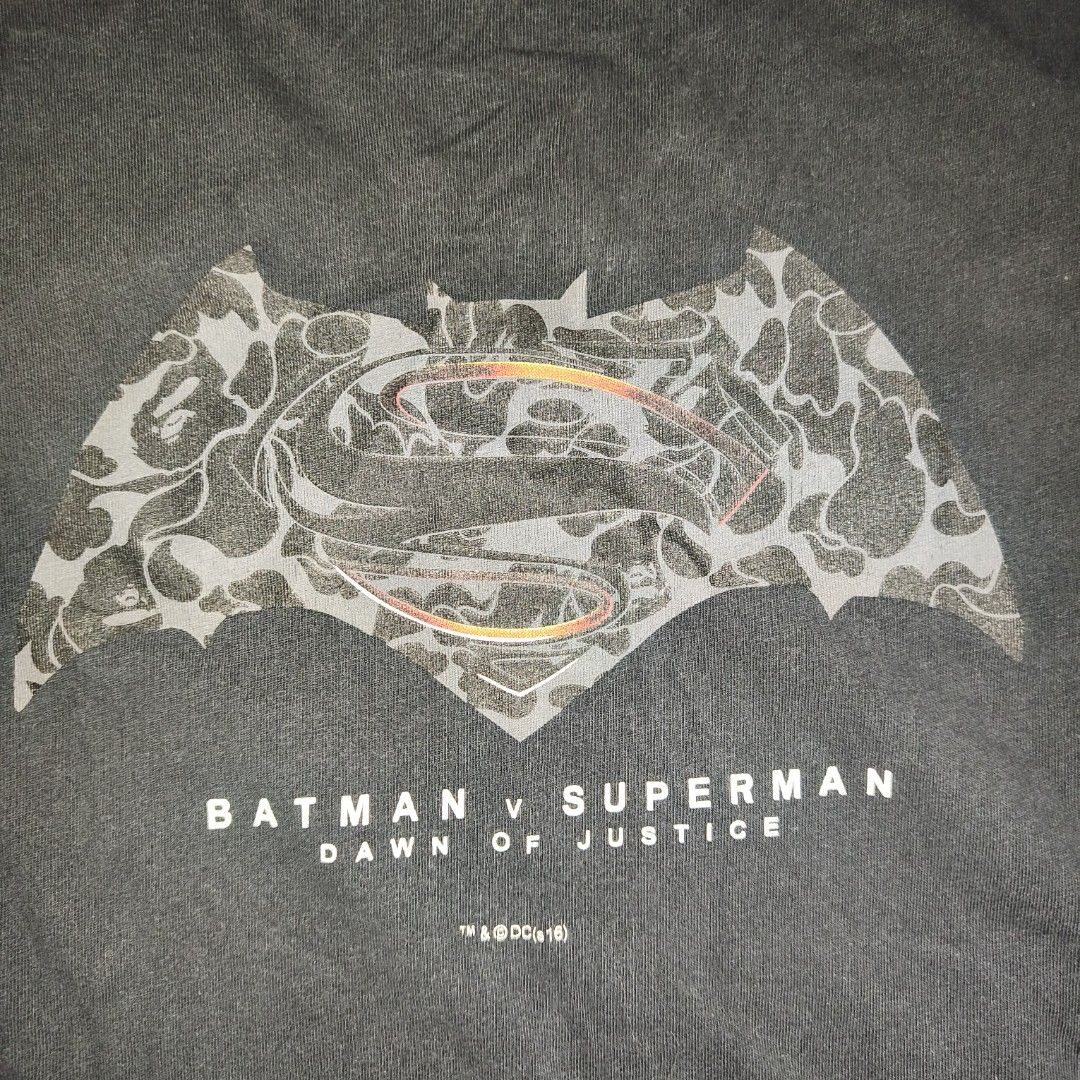 A Bathing Ape Batman v Superman T-Shirt (Category: Tshirts & Polo Shirts ) located in Antipolo. Submitted by alphaomega_fox (Listing ID 1468130073, Image 1). Description: - Brand: Bape x Batman v Superman: Dawn of Justice - Color: Black - Size: Large, 20x26 - Fit: Regular fit with short sleeves and crew neck - Details: Front graphic print, signature Bape sleeve tag, and official DC/Nowhere copyright prints - Condition: Excellent,.