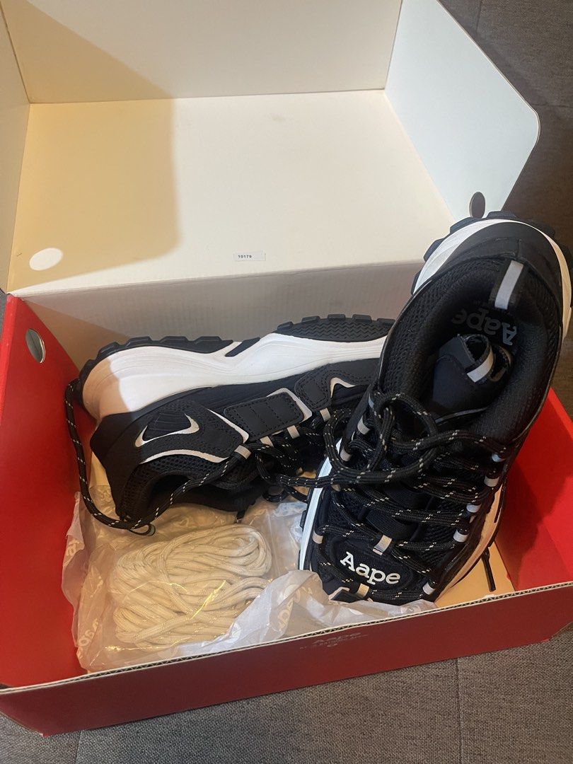 AAPE By A Bathing Ape Black White Sneakers (Category: Sneakers) located in Manila. Submitted by denyeiil (Listing ID 1468267430, Image 1). Description: - 100% Authentic AAPE by A Bathing Ape chunky sneakers - Colorway: Classic Black and White with bold branding on the tongue and side midsole - Sole: Thick treaded rubber outsole with signature logo imprint - Condition: Brand new, never worn, pristine condition inside the box - Inclusions: Original