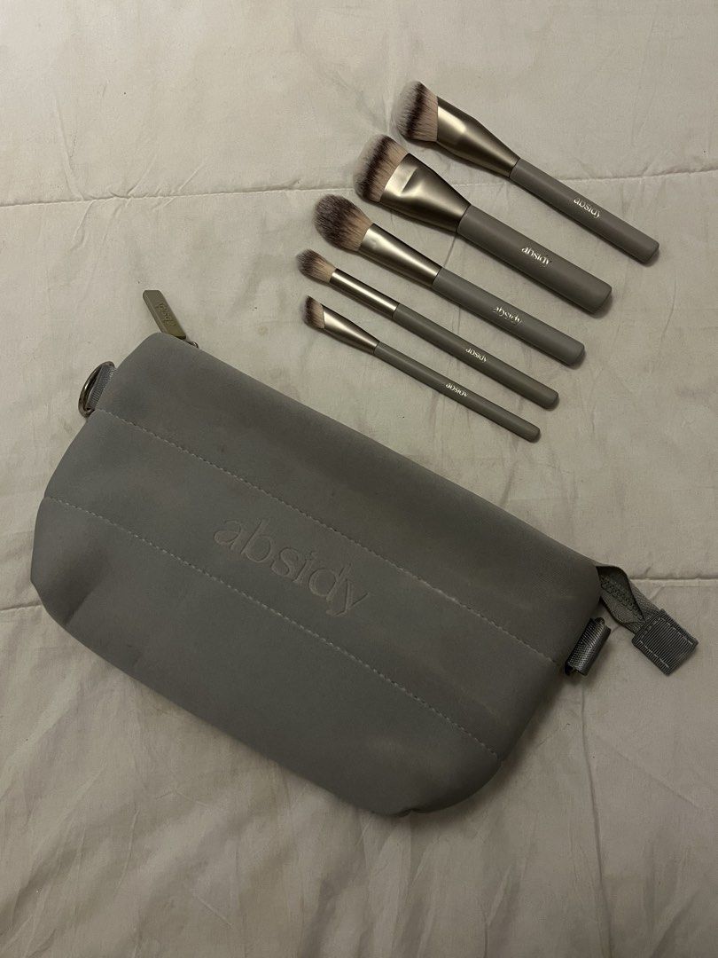 Absidy Makeup Brush Set with Pouch (Category: Makeup) located in Manila. Submitted by beautyarchives (Listing ID 1468208228, Image 1). Description: absidy brush set your everyday makeup essentials for a seamless beauty routine • includes 5 premium grey makeup brushes • matching zippered makeup pouch with embossed absidy logo • sleek grey handles with elegant silver lettering • protective mesh guards to keep the brush bristles in shape • perfect f