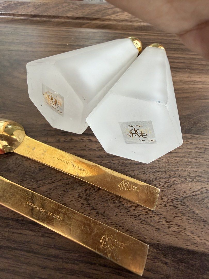 Adam & Eve Table Ware Salt Pepper Shakers with Spoons (Category: Dinnerware & Cutlery) located in Digos. Submitted by old_soul. (Listing ID 1468097873, Image 2). Description: - Authentic vintage Adam & Eve tableware set by Hikichi Corp Japan - Includes 2 frosted glass salt and pepper shakers with gold-tone tops - Features original brand stickers on the bottom of the shakers - Comes with 2 matching spoons marked 18-8 stainless steel and 24 k.g.p. 