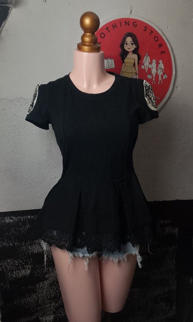 Adam Pour Eve (Category: Blouses) located in Manila. Submitted by jonahq.9 (Listing ID 1468214507, Image 1). Description: 📋 Item Details - Brand: Adam Pour Eve (Adam & Eve) — known for elegant, feminine fashion ​ - Style: Black peplum top with lace hem & Medusa/Greek statue portrait patches on sleeves ​ - Material: 100% cotton — soft, stretchy, breathable ​ - Design: Fitted bodice that flares at the waist, delicate lace trim at the bottom, uniqu