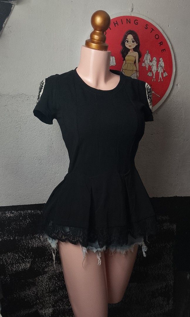 Adam Pour Eve (Category: Blouses) located in Manila. Submitted by jonahq.9 (Listing ID 1468214507, Image 2). Description: 📋 Item Details - Brand: Adam Pour Eve (Adam & Eve) — known for elegant, feminine fashion ​ - Style: Black peplum top with lace hem & Medusa/Greek statue portrait patches on sleeves ​ - Material: 100% cotton — soft, stretchy, breathable ​ - Design: Fitted bodice that flares at the waist, delicate lace trim at the bottom, uniqu
