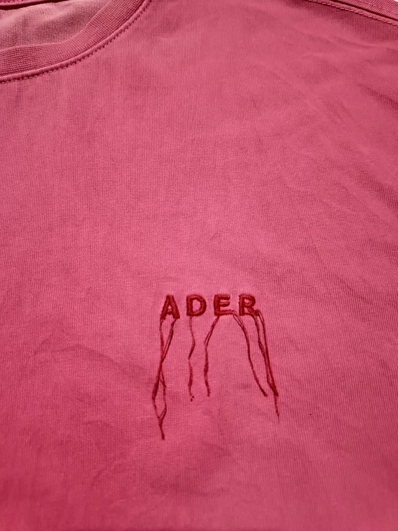 Ader Error 2021 Spring Summer Pink T-Shirt Size A1 (Category: Tshirts & Polo Shirts ) located in Barotac Nuevo. Submitted by gray101 (Listing ID 1468205319, Image 3). Description: - Authentic Ader Error SS21 collection - Vibrant pink colorway with embroidered dripping logo text - Crew neck, short sleeves, and unique layered hem details - Made from a durable cotton and polyester blend - Tagged size A1 (Regular fit) - Essential streetwear piece, pe