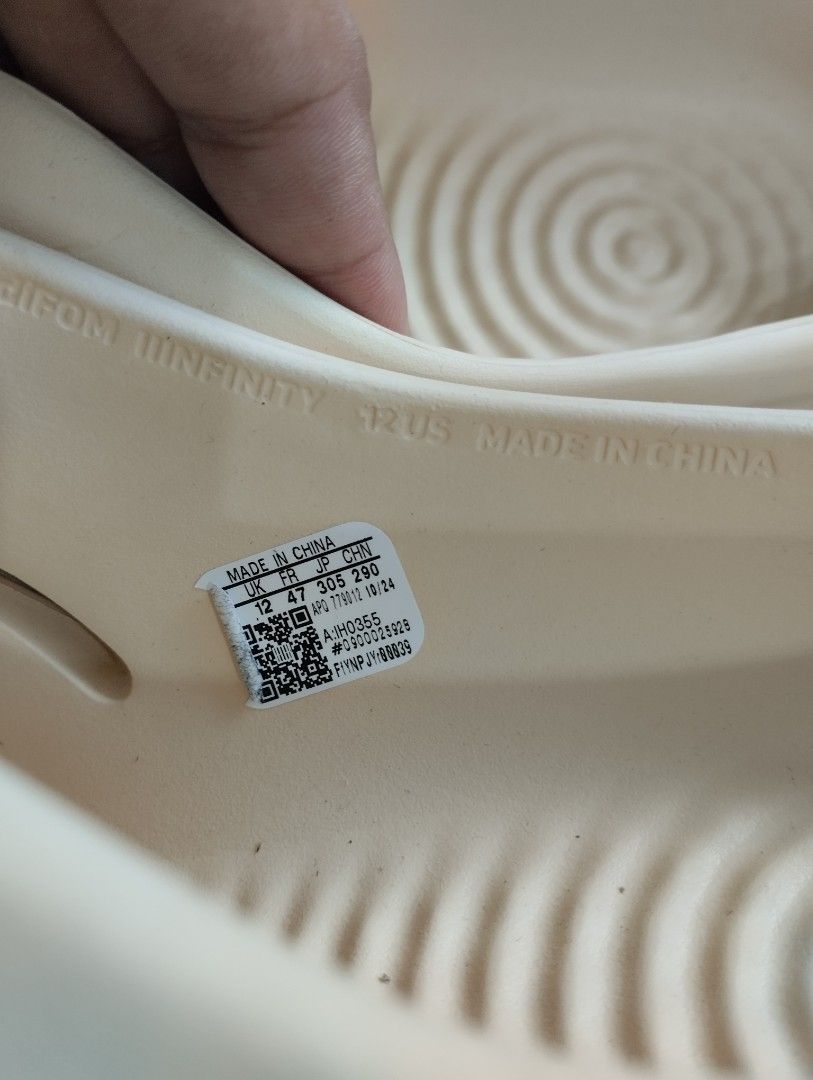 Adidas Adifom IIIInfinity Slides Off White Size 12 (Category: Slippers & Slides) located in Manila. Submitted by niggzreyno51476 (Listing ID 1468178545, Image 3). Description: - Brand: Adidas - Model: Adifom IIIInfinity Slides (IH0355) - Color: Off White - Size: 12 US / 47 FR - Condition: Brand new, never worn, with original tags still attached - Features: Slip-on design, ventilation side slits, and unique circular tread pattern - 100% authentic 