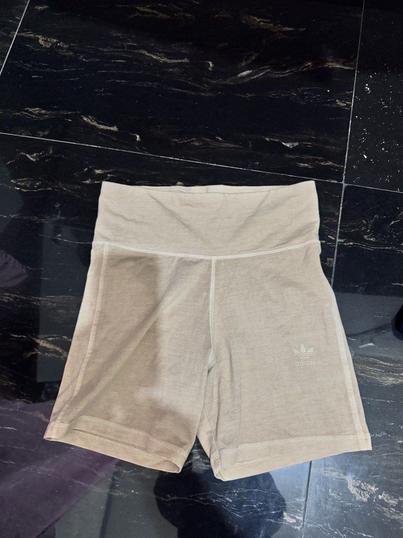 Adidas Beige Knit Legging Shorts (Category: Shorts) located in Rosales. Submitted by thriftingismygame (Listing ID 1468168669, Image 3). Description: - Brand: Adidas - Style: Knit biker shorts - Color: Beige - Size: UK 10 / US S - Condition: Brand new with tags (BNWT) - Fit: High waist with elastic waistband - Details: Embroidered trefoil logo near the hem - Material: Soft ribbed fabric, ideal for lounging or workouts.
