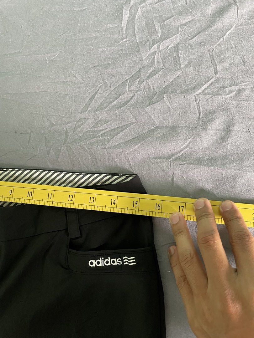 Adidas Black Trousers Pants Size L (Category: Jeans) located in Cagayan de Oro. Submitted by jekdels05 (Listing ID 1468063266, Image 2). Description: - Brand: Adidas - Color: Black - Size: Large - Style: Classic fit with button and zipper fly closure - Details: Embroidered logo near front pocket, stylish striped inner waistband lining - Condition: Good casual or athletic wear - Flat Measurements: Waist ~16.5 inches | Length ~34.5 inches | Leg Ope