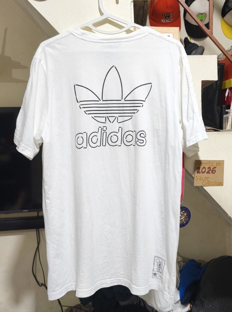 Adidas Disney T-Shirt White Medium Authentic (Category: Tshirts & Polo Shirts ) located in Pasig City. Submitted by althentic.ph (Listing ID 1468228628, Image 2). Description: 250 + J&T Shipping Fee Original ADIDAS x DISNEY Shirt for Men White Size Medium on tag, fits up to LARGE Actual Measurements: Width - 21" Length - 29" Very Good Thrifted Condition 9/10 ✔Tags are available upon request, can be sent thru PM ✔fix price ✔payment first policy th