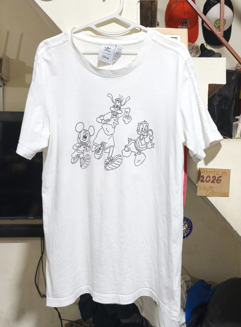 Adidas Disney T-Shirt White Medium Authentic (Category: Tshirts & Polo Shirts ) located in Pasig City. Submitted by althentic.ph (Listing ID 1468228628, Image 1). Description: 250 + J&T Shipping Fee Original ADIDAS x DISNEY Shirt for Men White Size Medium on tag, fits up to LARGE Actual Measurements: Width - 21" Length - 29" Very Good Thrifted Condition 9/10 ✔Tags are available upon request, can be sent thru PM ✔fix price ✔payment first policy th