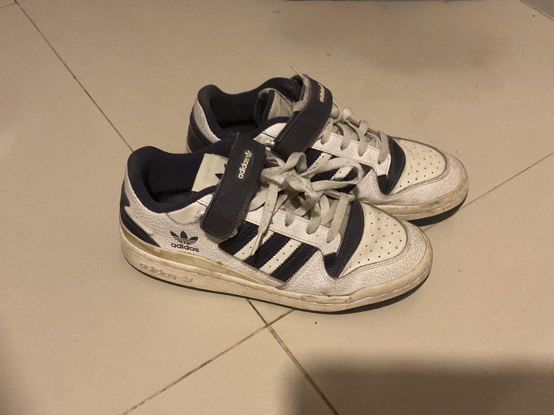Adidas Forum Low White Navy Sneakers (Category: Sneakers) located in Cebu City. Submitted by sof09 (Listing ID 1468103200, Image 2). Description: - Brand/Model: Adidas Forum Low - Colorway: White and Navy Blue - Style: Retro basketball sneakers with ankle strap and laces - Material: Leather upper with breathable toe box perforation - Branding: Iconic Trefoil logo on side and tongue - Condition: Pre-loved with visible sole wear and natural yellowi
