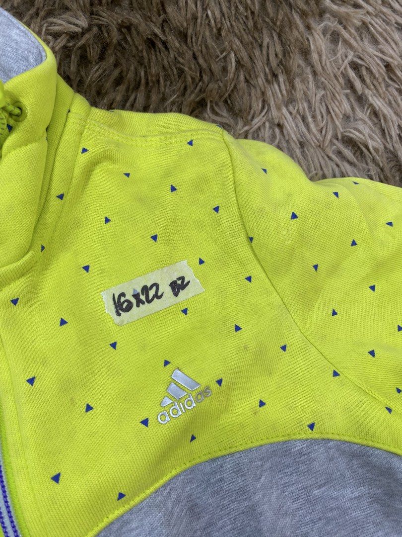 Adidas Full Zip Jacket Gray Lime Green Size S (Category: Coats, Jackets and Outerwear) located in Cagayan de Oro. Submitted by sepamorash53558 (Listing ID 1468266396, Image 2). Description: - Brand: Adidas - Style: Full zip jacket with high collar and drawstring - Color/Design: Gray bottom, neon lime green top and sleeves with all-over blue triangle pattern - Size: S (Pit-to-pit: 16", Length: 22") - Pockets: 2 secure zippered front pockets - Mate