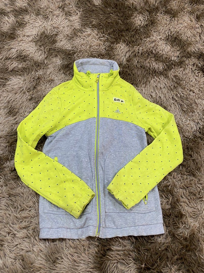Adidas Full Zip Jacket Gray Lime Green Size S (Category: Coats, Jackets and Outerwear) located in Cagayan de Oro. Submitted by sepamorash53558 (Listing ID 1468266396, Image 1). Description: - Brand: Adidas - Style: Full zip jacket with high collar and drawstring - Color/Design: Gray bottom, neon lime green top and sleeves with all-over blue triangle pattern - Size: S (Pit-to-pit: 16", Length: 22") - Pockets: 2 secure zippered front pockets - Mate