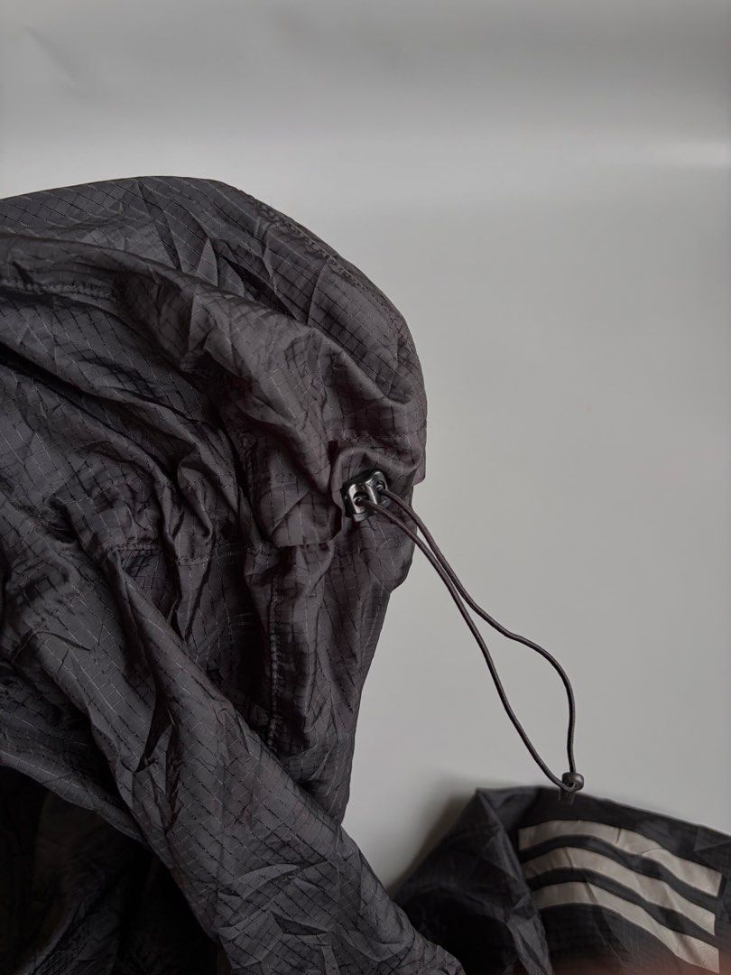 Adidas Own The Run Pack It Jacket (Category: Coats, Jackets and Outerwear) located in Kibawe. Submitted by jeloots (Listing ID 1468123867, Image 2). Description: - Authentic Adidas Own The Run Jacket in black - Durable ripstop fabric construction - Attached adjustable hood for extra weather protection - Full zip front closure - Reflective three stripes on shoulders and sleeves for low-light visibility - Convenient packable design - Size: Asian L 