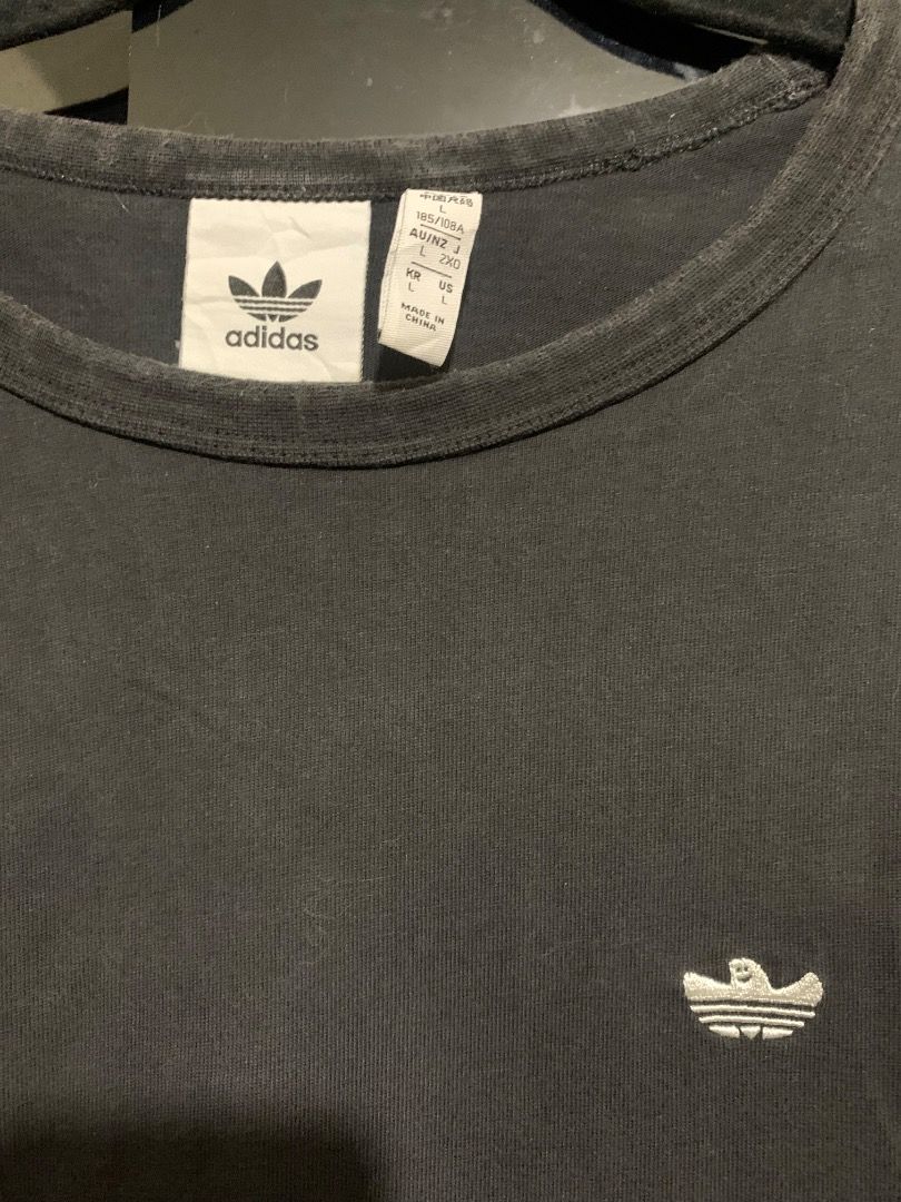 Adidas Shirt (Black) (Category: Tshirts & Polo Shirts ) located in Taguig. Submitted by reused.unused (Listing ID 1468206664, Image 2). Description: Adidas Shirt (Black) Embroidered Logo L on Tag 27in length (waist to hem) 9in length (sleeve) 21.5in width (shoulder) 21.5in width (pit to pit) Issue/s: signs of usage -refer to photos for actual condition -refer to close up photo for actual color -pre-loved item so signs of usage is expected -for se