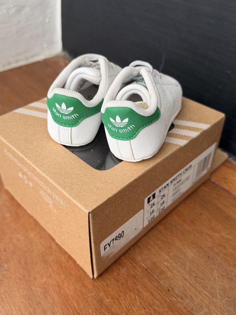 Adidas Stan Smith Crib (Category: Babies & Kids Fashion) located in Paranaque City. Submitted by ___iroiro___ (Listing ID 1468073472, Image 3). Description: - Item: Adidas Stan Smith Crib Baby Shoes - Color: White and Green - Size: US 2K / UK 2K / FR 18 - Condition: Brand new, never worn, pristine condition - Inclusions: Original cardboard box with matching product sticker (Model: FY7890) - Perfect for gifts or your baby's first stylish kicks! RF