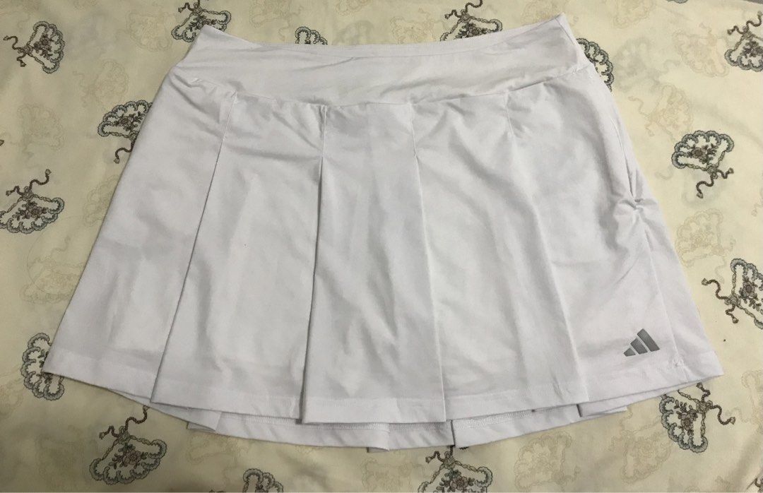 Adidas Tennis Skirt (Category: Activewear) located in Manila. Submitted by freshlemon58885 (Listing ID 1468096113, Image 1). Description: With Inner Cycling 2 side zipper pockets 1 zipper pocket at the back Rubberized Logo 3 Strips Medium on Tag to L .