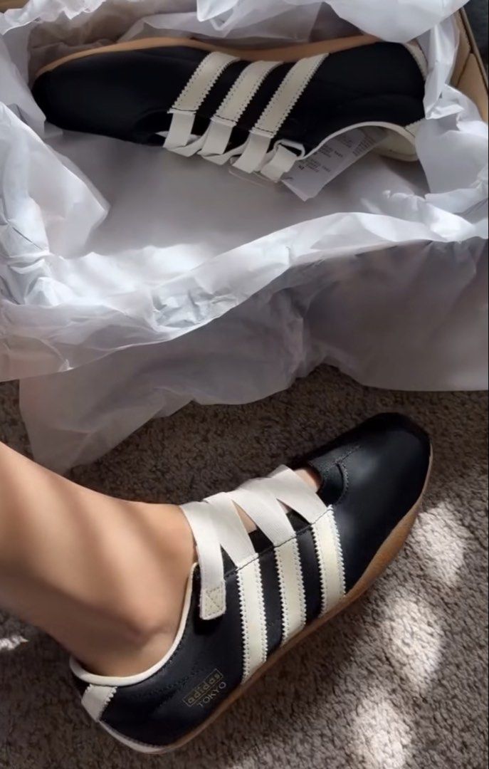 Adidas Tokyo MJ Black White (Category: Sneakers) located in Mandaluyong City. Submitted by mauriscarla (Listing ID 1464368245, Image 2). Description: - Adidas Tokyo sneakers - Color: Black with white stripes - Sole: Gum sole - Size: 245 J - Features: Adjustable straps for a secure fit - Ideal for: Casual wear Bought in Japan. Never been used.