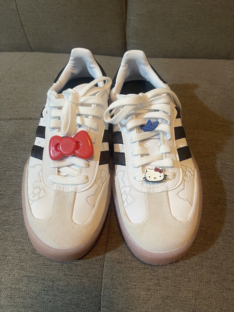 Adidas x Hello Kitty Sneakers (Category: Sneakers) located in Manila. Submitted by denyeiil (Listing ID 1468267377, Image 2). Description: - Brand/Model: Adidas x Kitty Sneakers - Size: EU 37 / UK 4 / US 6 - Color: White and black with translucent gum sole - Features: Cute embossed Kitty graphics, detachable red bow lace charm, and comfortable fit - Condition: Excellent, lightly used - Perfect for casual wear, streetwear, and collectors.
