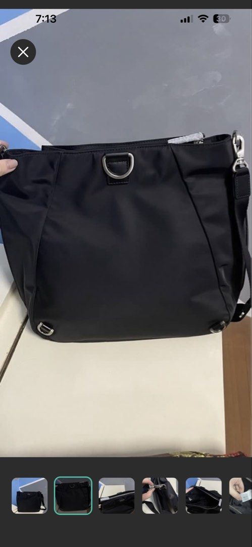 Agnès b. Black Nylon Shoulder Bag (Category: Shoulder Bags) located in Mandaluyong City. Submitted by nescreates (Listing ID 1468072653, Image 2). Description: - Brand: Agnès b. (Model: FS02-04) - Material: Durable black nylon with silver-tone hardware - Conditio: Like new - Features: Iconic metal logo plate, secure zip top closure, and lined interior with brand tags - Strap: Adjustable strap with sturdy clasps for custom comfort 📌Two way can be