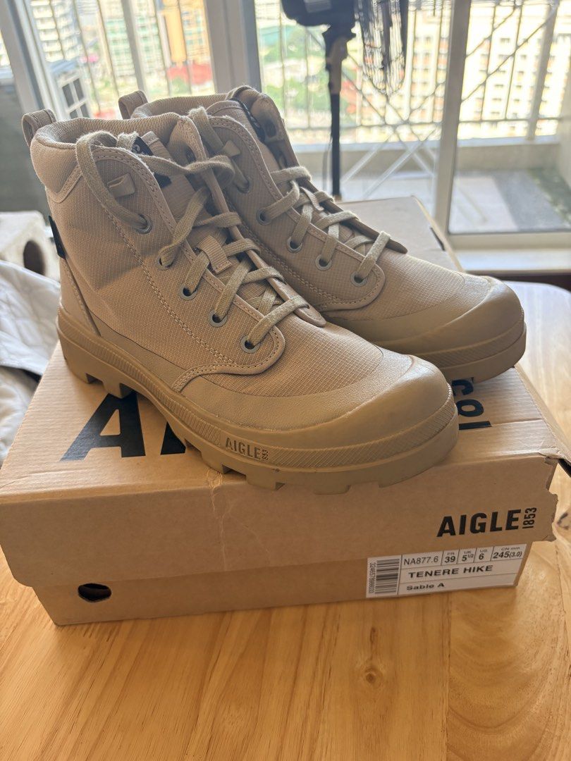 Aigle Tenere Hike Boots Sable A (Category: Boots) located in Quezon City. Submitted by soleil_07 (Listing ID 1468072016, Image 2). Description: - Brand: Aigle - Model: Tenere Hike boots - Color: Sable (neutral beige) - Condition: Includes original shoe box - Features: Durable lug soles, lace-up closure, sturdy ankle support, and reinforced toe cap - Sizing: Marked on the box label US 7 and US 6 CN mm 250 and CN mm 245 Both used twice only. City w