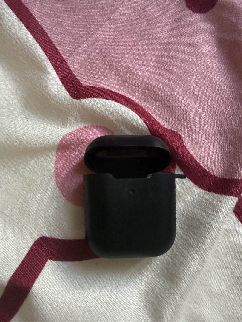 AirPods silicone case bundle black and floral (Category: Cases & Sleeves) located in Quezon City. Submitted by carpiorosa21379 (Listing ID 1468092558, Image 1). Description: - Includes 2 protective cases for standard AirPods charging cases - Black silicone case: features a subtle power symbol on the back and a convenient strap loop - Clear floral case: decorated with an all-over white and pink flower print - Protects your charging case from every