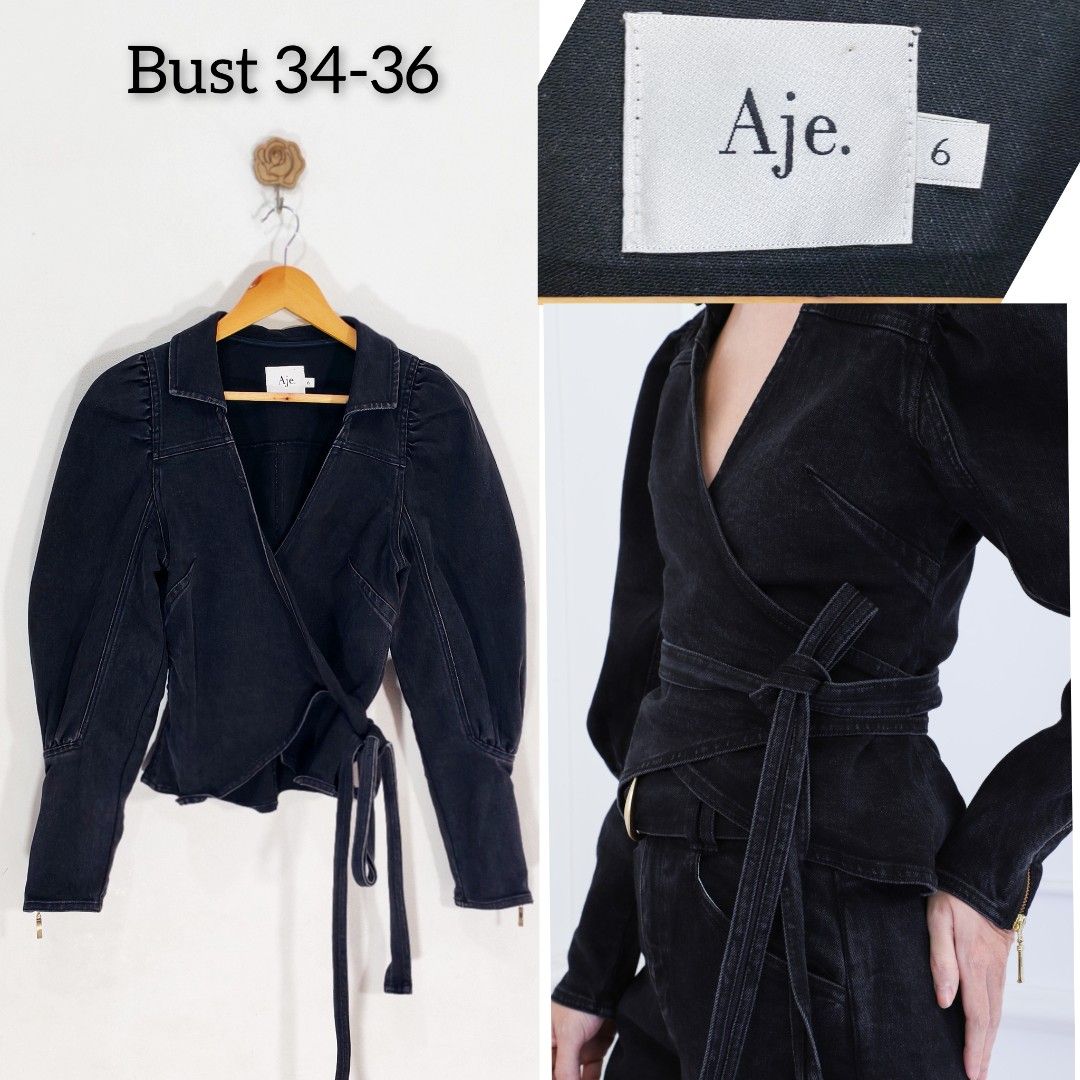 AJE Black Denim Wrap Top Negotiable (Category: Blouses) located in Marikina City. Submitted by Essential.Gallery_ (Listing ID 1468183895, Image 1). Description: - Brand: Aje - Item: Black denim wrap top - Size: 6 (Tag attached) - Fit: Bust 34-36 - Details: Long sleeves with puff shoulders, self-tie wrap belt, structured collar, V-neckline - Material: Heavy dark wash denim - Styling: Great with high-waisted jeans or trousers.