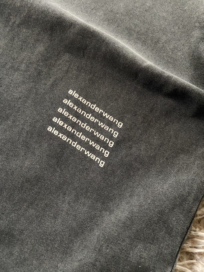 Alexander Wang Acid Wash Logo Tee Size L (Category: Tshirts & Polo Shirts ) located in Manila. Submitted by coollion.19b40f (Listing ID 1468255939, Image 2). Description: - Brand: Alexander Wang - Color: Washed black / dark grey - Size: Large - Material: 100% cotton (Made in Vietnam) - Design: Short sleeves, crew neck, small stacked logo print near bottom front hem - Condition: Brand new with tags attached.