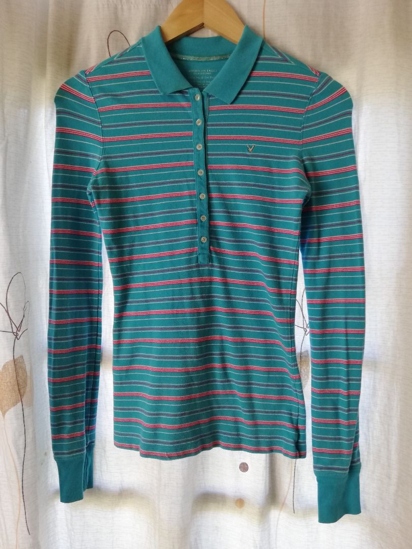 American Eagle Long Sleeve Striped Top (Category: Tshirts & Polo Shirts ) located in Makati City. Submitted by bananafishph (Listing ID 1468132887, Image 2). Description: - Material: Cotton and spandex blend - Fitted -Personally owned by seller and not from ukay. -Clean and washed - Slight flaw: Di sya kita, but If you raise the collar merong very faint yellowish spots (check last photo for reference) _____________ MOP: Gcash, BPI, Maya only. Shi