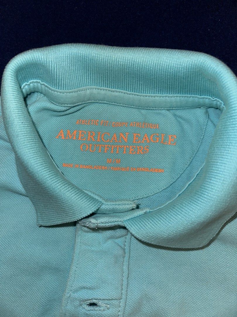 American Eagle Polo shirt (Category: Tshirts & Polo Shirts ) located in Quezon City. Submitted by mancave_stuff (Listing ID 1468168789, Image 2). Description: Authentic American Eagle Men’s Polo Shirt (Turquoise / Teal) American Eagle short-sleeve polo shirt in a vibrant turquoise / light teal color. Features a contrasting neon orange embroidered eagle logo on the chest. Very comfortable, lightweight pique cotton material. • Brand: American Eagle
