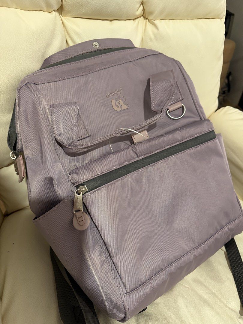 Anello Expand Backpack Purple (Category: Backpacks) located in Manila. Submitted by anning03 (Listing ID 1468192087, Image 1). Description: - Brand: Anello Expand Backpack - Color: Purple (with tag still attached on strap) - Material: Lightweight and durable nylon - Compartments: Spacious main compartment with a convenient zippered front pocket - Features: Dual top carry handles - Condition: Brand new with tags - Ideal for: School, work, or every