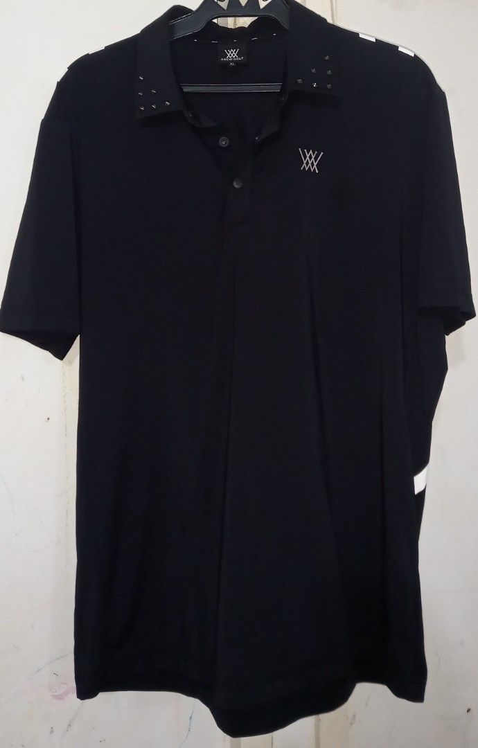 Anew Golf Black Polo Shirt With Studs Size XL (Category: Tshirts & Polo Shirts ) located in Cagayan de Oro. Submitted by edwardryan01984 (Listing ID 1468193621, Image 1). Description: - Brand/Model: Anew Golf Polo Shirt - Color: Black - Size: XL - Details: Short sleeves, button placket, and stylish studded collar - Design: Large geometric white graphic on the back with subtle logo embroidery on the left chest - Condition: Clean overall with minim
