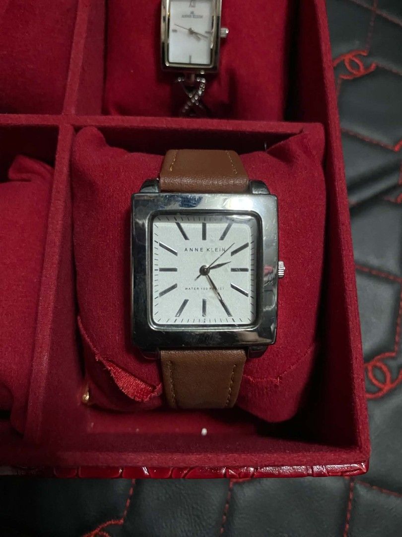 Anne Klein Square Watch Brown Leather Strap (Category: Women's Watches) located in Marikina City. Submitted by jvdshop (Listing ID 1468173884, Image 1). Description: - Brand: Anne Klein (Model AK/1113) - Movement: Y121E - Dial: White dial with a sleek silver-tone bezel - Strap: 18mm genuine brown leather band - Materials: Stainless steel case back - Water Resistance: Up to 100 feet - Style: Classic, versatile everyday timepiece.