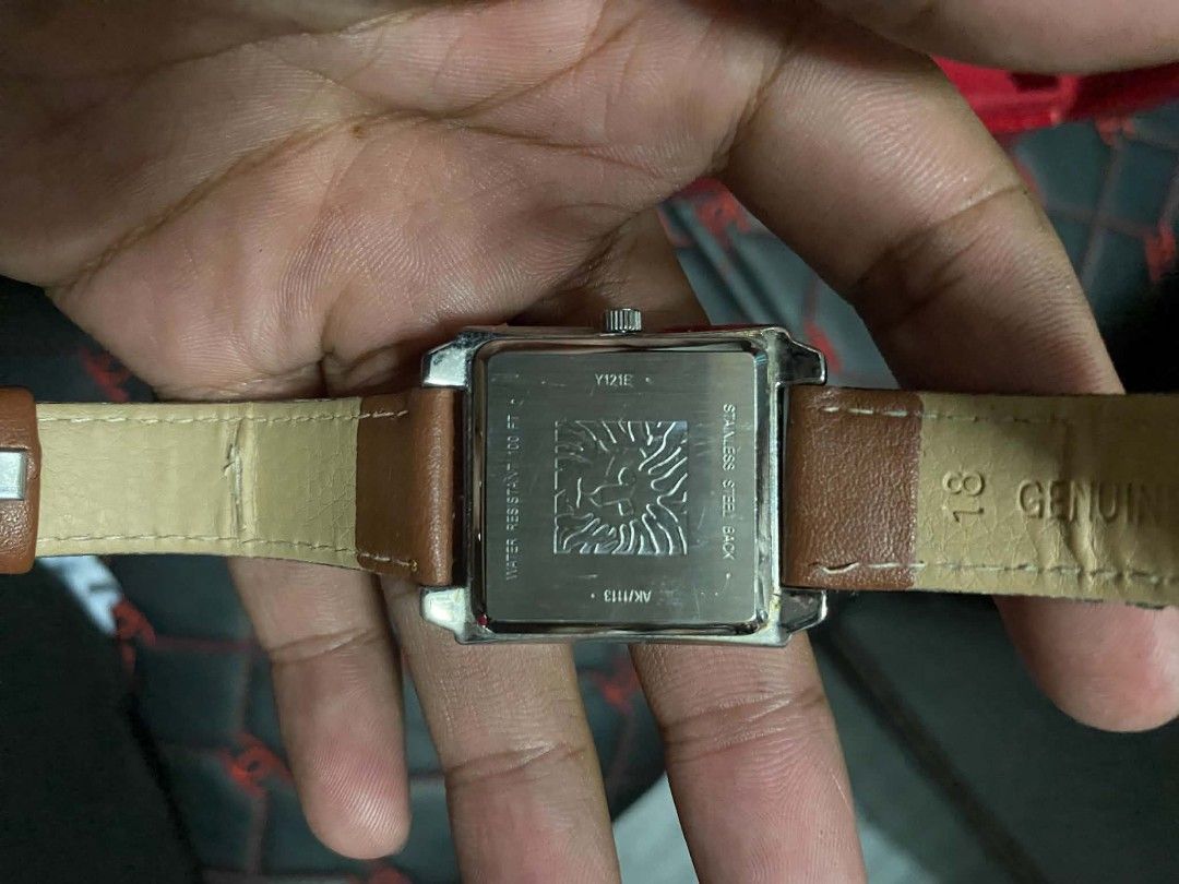 Anne Klein Square Watch Brown Leather Strap (Category: Women's Watches) located in Marikina City. Submitted by jvdshop (Listing ID 1468173884, Image 2). Description: - Brand: Anne Klein (Model AK/1113) - Movement: Y121E - Dial: White dial with a sleek silver-tone bezel - Strap: 18mm genuine brown leather band - Materials: Stainless steel case back - Water Resistance: Up to 100 feet - Style: Classic, versatile everyday timepiece.