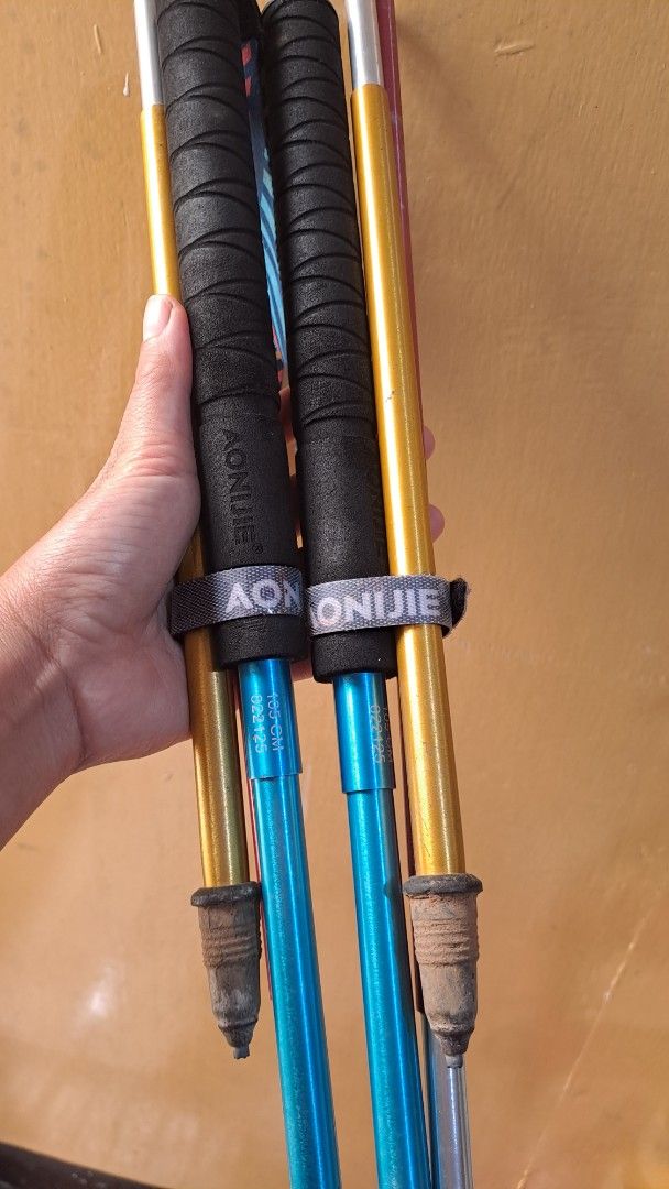 Aonijie Folding Trekking Poles 105cm (Category: Hiking & Camping) located in Baguio. Submitted by Zibs_Collection (Listing ID 1468095410, Image 1). Description: - Brand/Model: Aonijie Foldable Trekking Poles - Size: 105 cm length - Features: Comfortable foam grips, stylish patterned wrist straps, durable metal shafts, and rubber tips - Condition: Used with minor scuffs on the body - Best For: Hiking, trail running, and outdoor walking adventures.