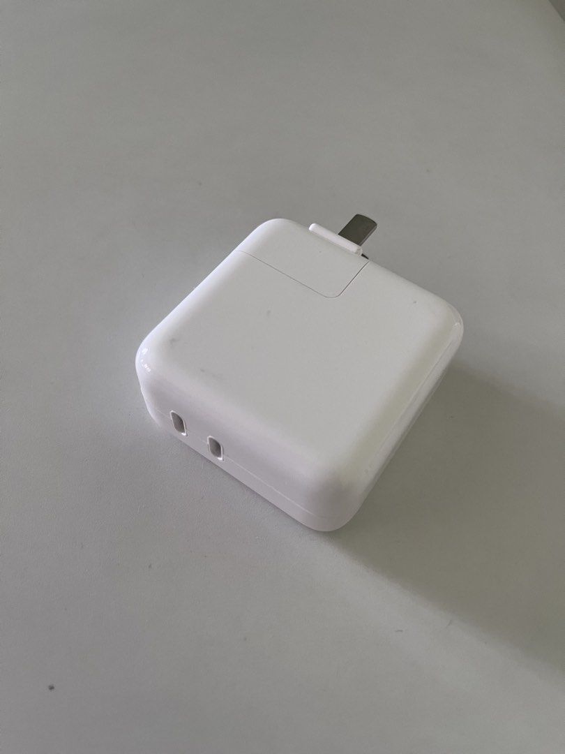 Apple 35W Dual USB-C Port Power Adapter (Category: Chargers & Cables) located in Pasig City. Submitted by instawardrobe (Listing ID 1468100591, Image 3). Description: - Authentic Apple 35W dual USB-C power adapter (Model MW2K3CH/A) - Charge two devices simultaneously with ease - Compact design featuring convenient fold-down prongs for travel - Barely used and in perfect working condition - Comes with the original box included.