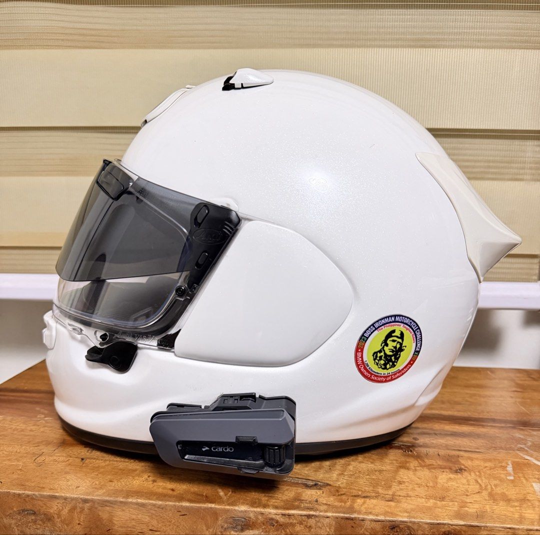 Arai Helmet with Cardo Packtalk Edge (Bundle!) (Category: Headphones & Headsets) located in Marikina City. Submitted by meandmyprelovedstuff (Listing ID 1468212551, Image 2). Description: ARAI ASTRO-GX Snell Certified With Cardo Packtalk Edge Size Medium or 57-58 cm Bought in 2023 Box not guaranteed (hahanapin pa) - Color/Finish: Gloss white - Visor: Tinted - Comms: Cardo bluetooth unit mounted - Accessories: Rear spoiler attachment and small com