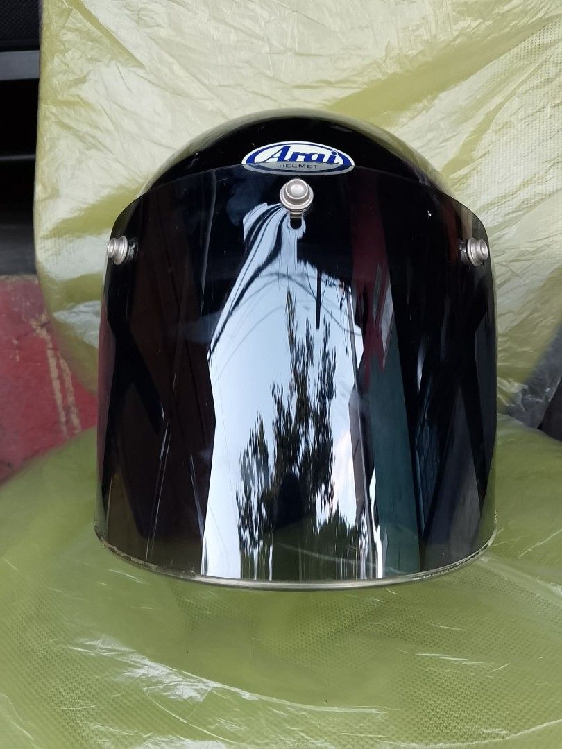 Arai Open Face Motorcycle Helmet with Dark Visor (Category: Caps & Hats) located in Quezon City. Submitted by jpnvintageonline (Listing ID 1468235945, Image 3). Description: - Brand: Arai - Type: Open-face helmet - Color: Black with iconic blue Arai branding - Visor: Dark tinted snap-on bubble visor included - Interior: Deep blue interior lining - Closure: Secure D-ring strap - Condition: Minor surface wear from normal handling, visor has light u