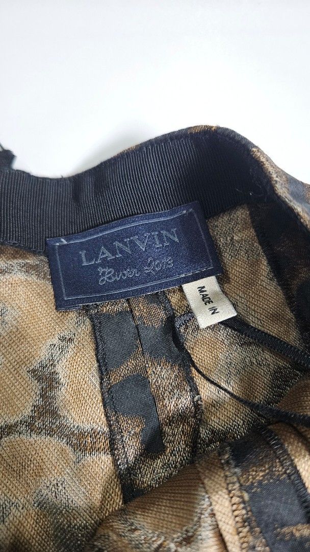 Archive Lanvin Paris Leopard Print Silk Blend Skirt (Category: Skirts) located in Alfonso. Submitted by jbcamet (Listing ID 1468192801, Image 3). Description: - Brand: Lanvin Paris (Made in France) - Print/Color: Brown and black leopard print - Material: 79% acetate, 21% silk - Size: T.38 - Features: Gathered pleated tiers and secure back zipper closure - Condition: Premium designer piece, lightweight feel with clean interior tags intact.