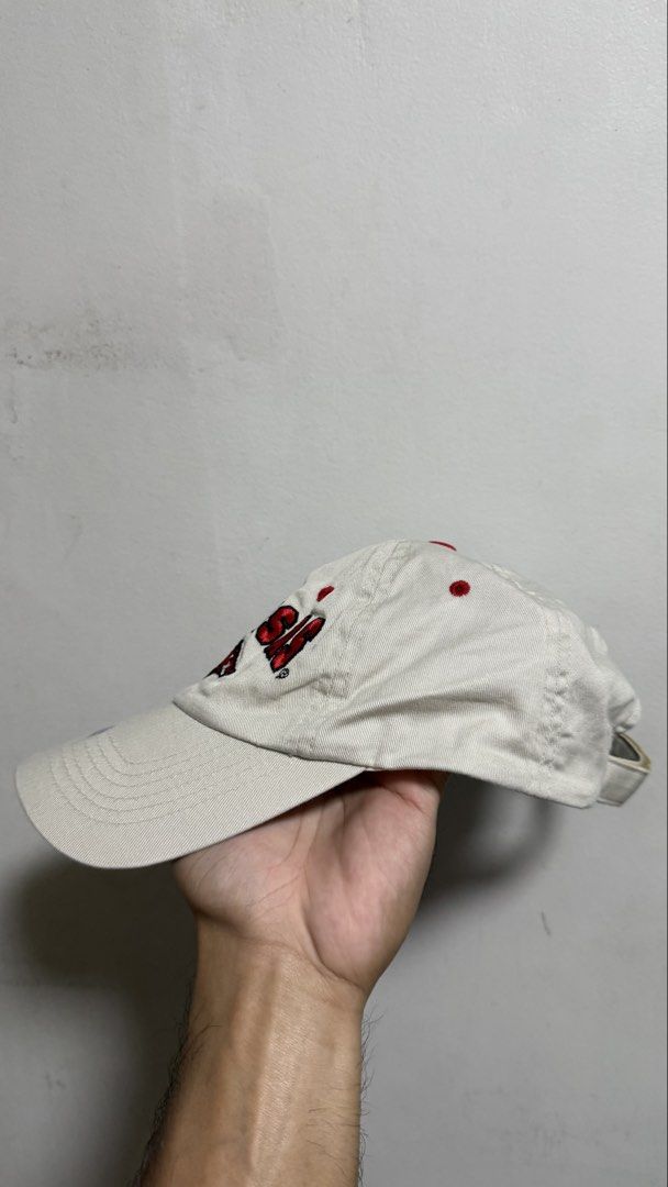 Arkansas Razorbacks Embroidered Baseball Cap White Red (Category: Caps & Hats) located in Quezon City. Submitted by kobeeeee_12 (Listing ID 1468147091, Image 3). Description: - Item: Arkansas Razorbacks College Hat - Color/Material: White cotton twill with red embroidered lettering and mascot - Details: Small red embroidered razorback patch on the adjustable back strap - Condition: Good, but has a small dark spot/stain on the brim near the stitch