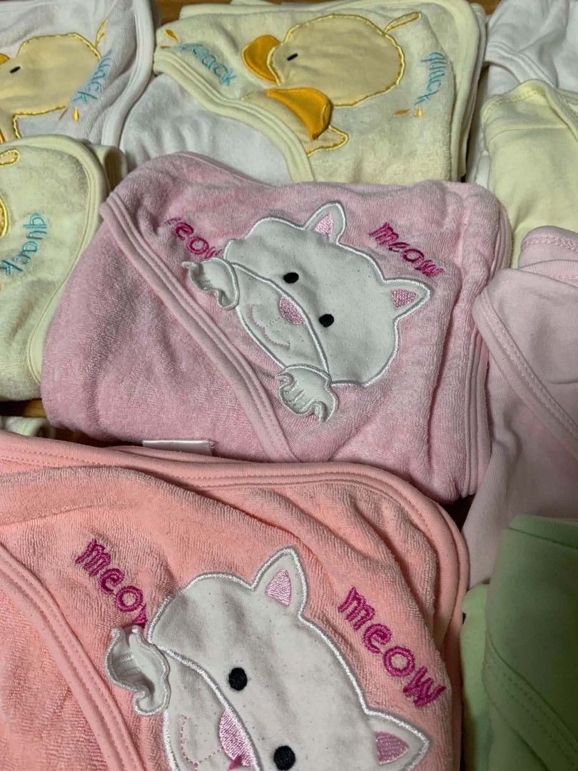 Assorted baby hooded towels /receiving blankets (Category: Babies & Kids Fashion) located in Cainta. Submitted by akosijoan (Listing ID 1468178729, Image 2). Description: - Bundle of soft baby towels and blankets - Features cute duck and cat embroidered hoods - Pastel shades: pink, yellow, green, and white - Gentle fabric ideal for bath time and swaddling - Selling as a set Take all 10 for 600.