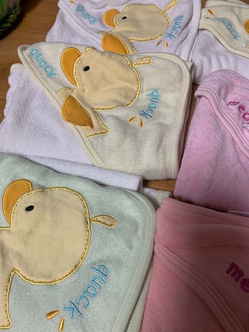 Assorted baby hooded towels /receiving blankets (Category: Babies & Kids Fashion) located in Cainta. Submitted by akosijoan (Listing ID 1468178729, Image 3). Description: - Bundle of soft baby towels and blankets - Features cute duck and cat embroidered hoods - Pastel shades: pink, yellow, green, and white - Gentle fabric ideal for bath time and swaddling - Selling as a set Take all 10 for 600.