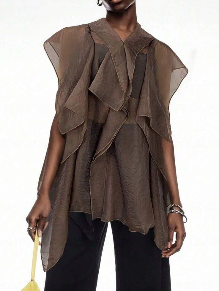Assymetrical Ruffled Blouse Cape Top (Category: Blouses) located in Binan City. Submitted by myprelovedhaul (Listing ID 1468069487, Image 1). Description: This item appears to be a coffee brown or espresso sheer asymmetrical ruffle blouse or cape top (such as the Trendyol Asymmetrical Blouse or similar flowy mesh/chiffon styles from brands like SHEIN and Soly Hux).
