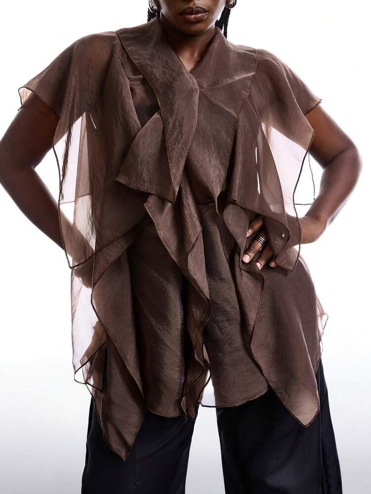 Assymetrical Ruffled Blouse Cape Top (Category: Blouses) located in Binan City. Submitted by myprelovedhaul (Listing ID 1468069487, Image 2). Description: This item appears to be a coffee brown or espresso sheer asymmetrical ruffle blouse or cape top (such as the Trendyol Asymmetrical Blouse or similar flowy mesh/chiffon styles from brands like SHEIN and Soly Hux).