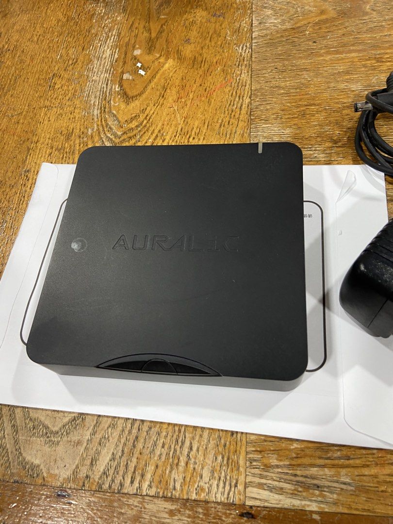 Auralic Aries Mini Wireless Streaming Node (Category: Soundbars, Speakers & Amplifiers) located in Singapore. Submitted by speakerphone51 (Listing ID 1468088950, Image 2). Description: - Model: Auralic Aries Mini (Black) - Condition: Fully functional, ready for your audio setup - Included: Original power adapter with European plug - Connectivity & Outputs: Ethernet port, 2x USB ports, optical out, coaxial out, and RCA stereo outputs - Verificatio